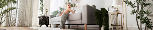 Baby learning to walk safely at home with fall prevention measures