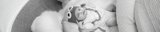 calm baby felt asleep on soft cushion